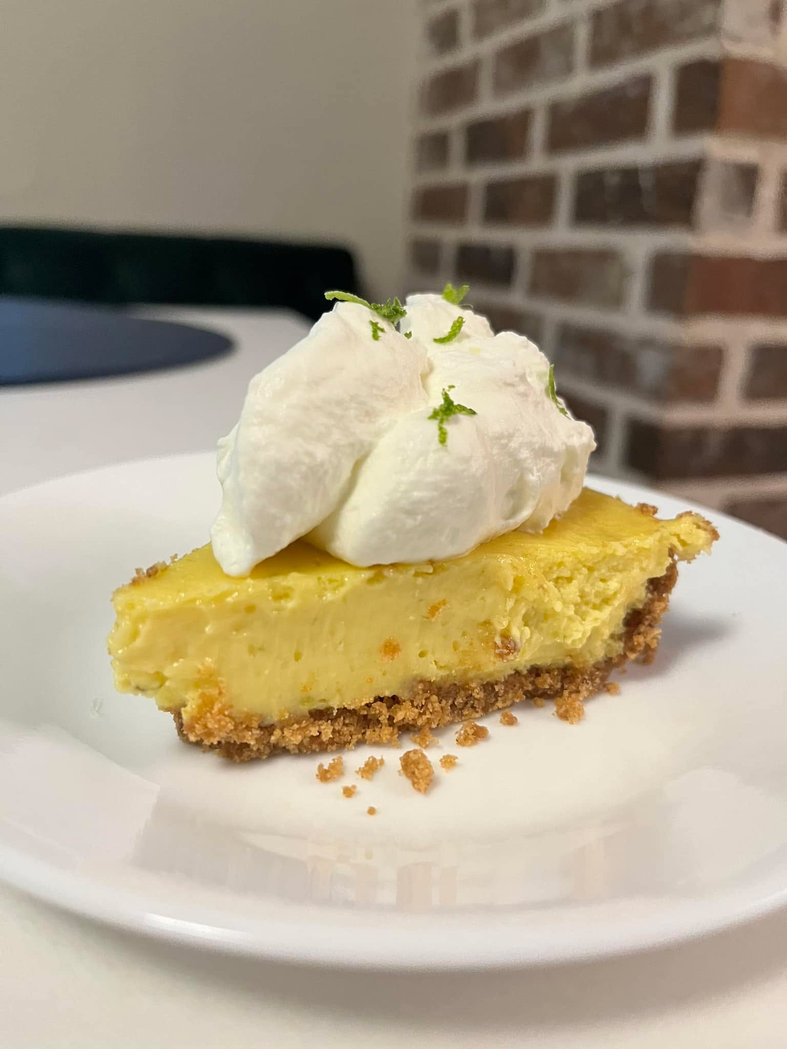 Sara Armson got her favorite pie today. Happy Pie Day (3.14). Gluten Free Key Lime pie with homemade sweet cream. 🥧 🍋🟩 ❤️