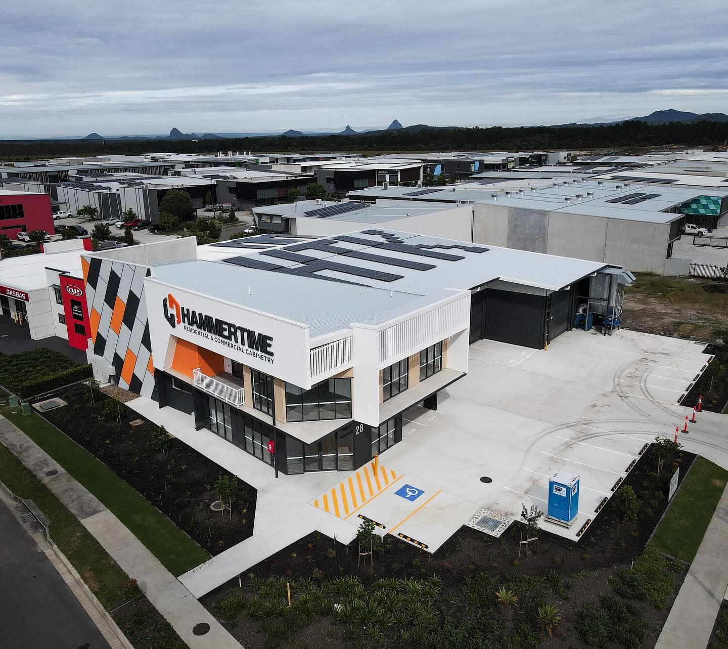New 887sqm build for @hammertimekitchens in Baringa. Hard to miss this one when youโre driving into Aura! Creative touch with the solar panels.