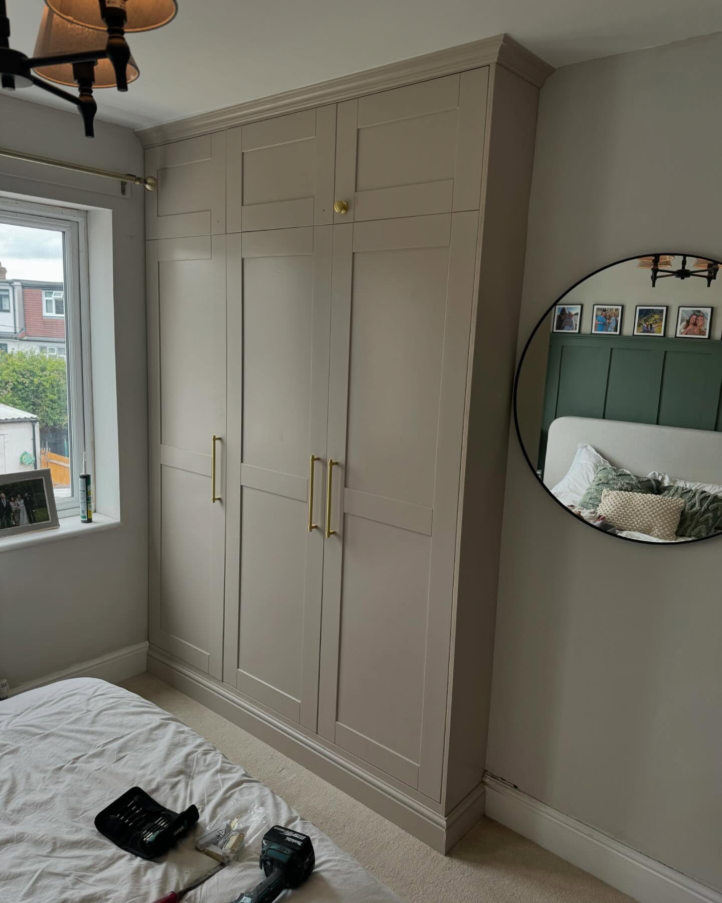 Custom wardrobe built around boiler