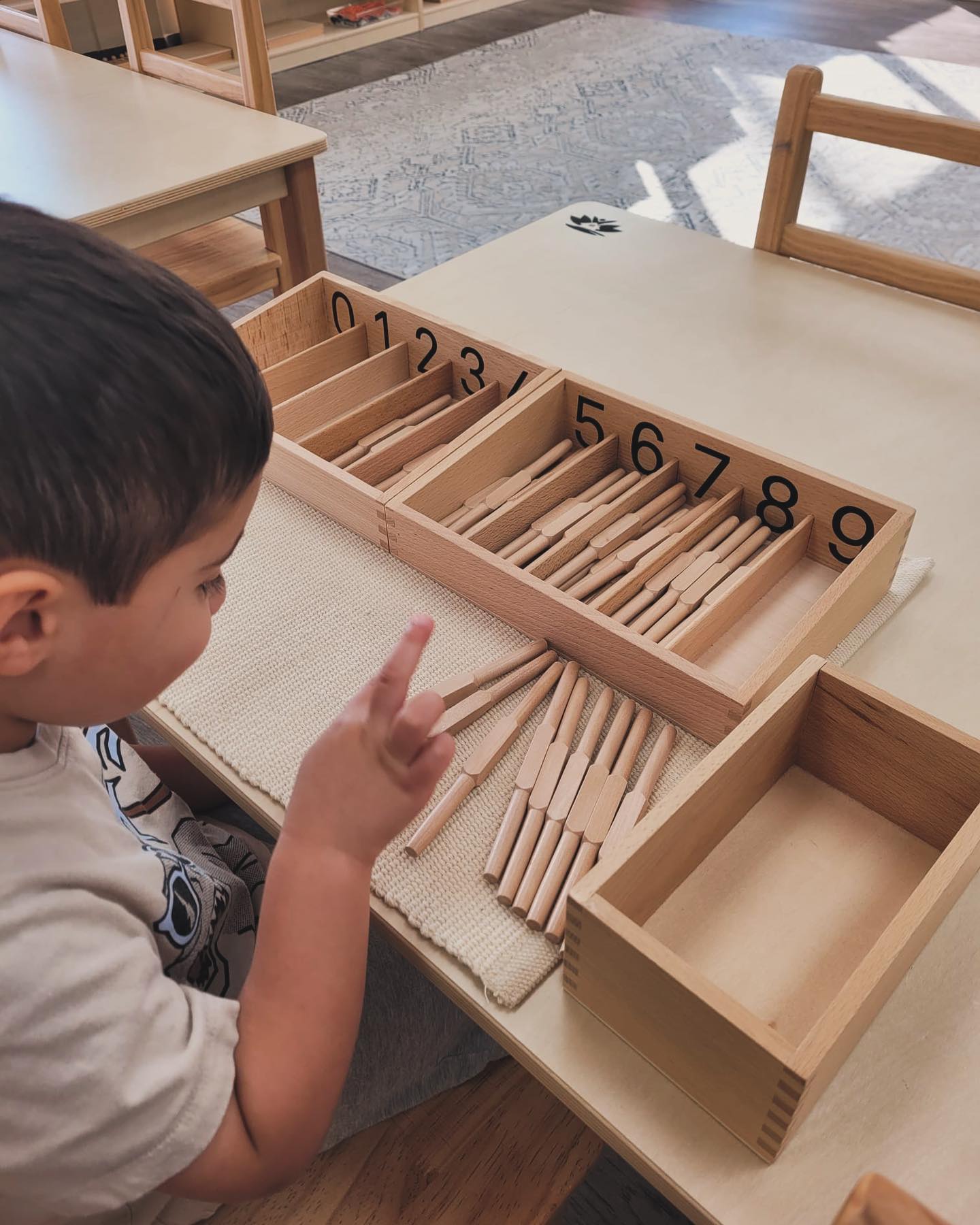 At Lily Montessori, we use the Spindle Box to teach kids in Preschool early math skills. ๐งฎโจ By placing spindles in the right compartments, little ones connect numbers with real quantities, boosting their counting and confidence! Itโs a simple, hands-on activity that helps kids learn and grow. ๐ฑ #LilyMontessori #EarlyLearning #CountingMadeFun #daycare #ottawa #montessoriottawa