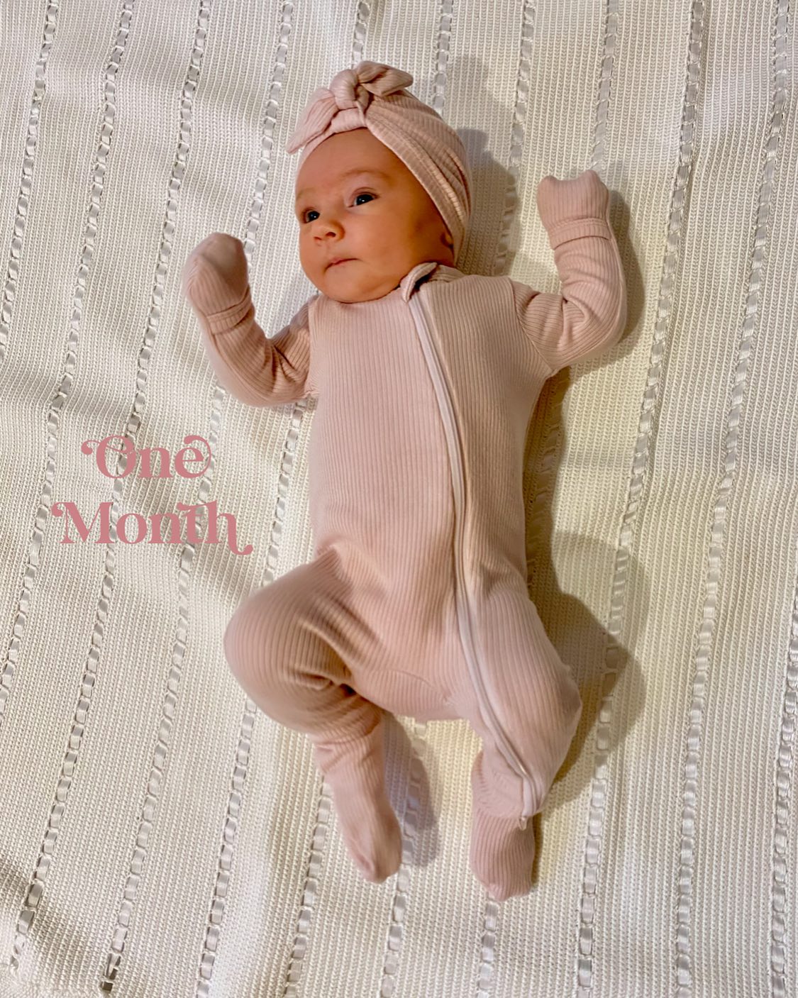 One Month with our Isabella! 🎀
Laying on a handmade blanket made just for her by my Aunt Kathy. It is so beautiful.