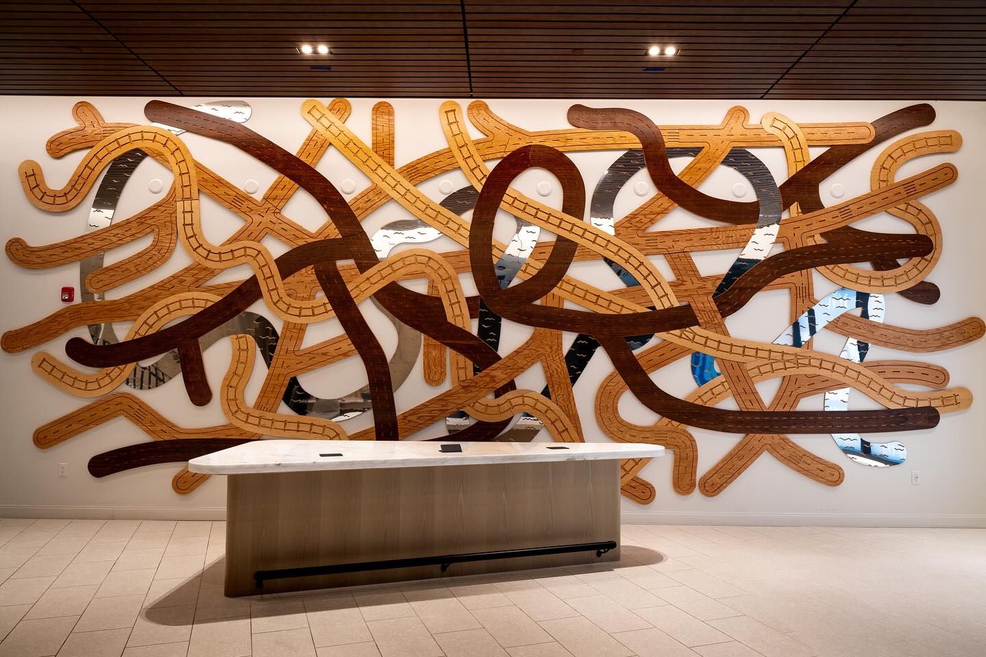 Woven City is here! Allston, say hello to a new, 31’ x 14’, wood and metal, friend 😊 This has been the focus of a year+ of my work and I’m so happy to finally share the full image of the installation’s main artwork - much like Beyoncé, I don’t like sharing full works of art until they’re ready to wow. So, Instagram, here it is :) Over the next week, I’ll be posting some photos from the reception, detail shots of the main artwork, and the four complimentary paintings to the main work.
Let me know what ya think 😊🤗 Happy to answer any questions about the art here.
.
.
.
Obviously, thank you’s all around to @thehamiltoncompany for commissioning the work and being a great project partner, @a.little.bird for your help with concept development and installation, @whatfurreal @mmgilleran @annabellaramaci @vasoirre for help with installation, and, of course @estemar720 for your stunning photographs of the art!
.
.
.
#WovenCity #publicart #communityart #bostonart #fineart #installationart #artinstallation #sitespecificart #bosart #woodart #metalart #sculpture #wallsculpture #transitart #trainart #choochooArt #urbanism #allston #allstonart #allstonbrighton