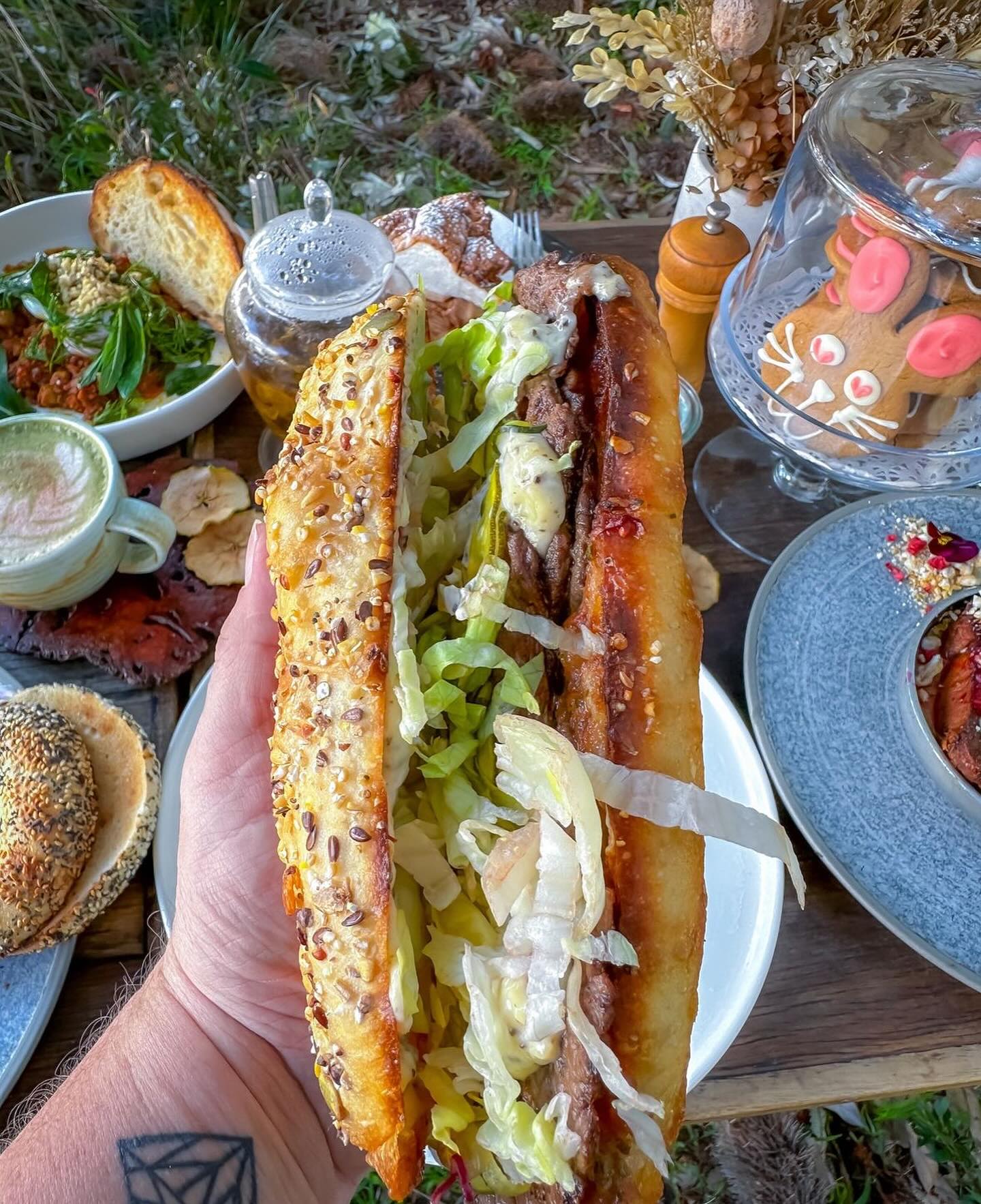 🥩🌟 Dive into flavor at Lion and Buffalo Cafe with our famous steak sandwich! Tender, juicy steak piled high with fresh, crispy toppings and served on a perfectly toasted seeded ciabatta roll. It’s a taste you won’t forget. Come on over and get your steak fix today! 🥪🔥 #LionAndBuffaloCafe #SteakSandwich #FoodieFavorites