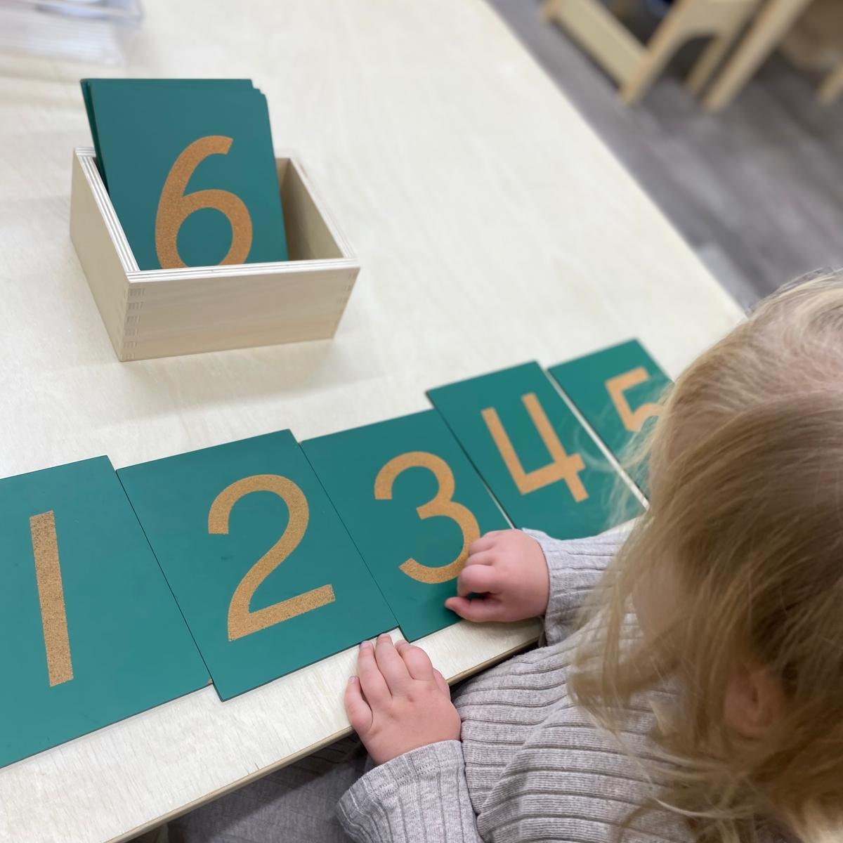 ๐ Exploring Numbers with Sandpaper Numerals at Lily Montessori! ๐ขโจ
The Sandpaper Numerals are a Montessori classic that helps children learn to recognize and trace numbers through tactile exploration. By feeling the rough texture of each numeral and tracing it with their fingers, children build fine motor skills, hand-eye coordination, and a strong foundation for number recognition. ๐ฟ
This hands-on activity introduces early math concepts while fostering focus, independence, and sensory learningโthe perfect start for future mathematicians! ๐ก
๐ Ready to give your child a head start with hands-on learning? Enroll today! (Link In Bio)
๐ฑ+1 613-222-3666
#LilyMontessori #SandpaperNumerals #NumberRecognition #FineMotorSkills #MontessoriMaterials #HandsOnLearning #EarlyChildhoodEducation #MontessoriLife #OttawaChildcare #OttawaPreschool #MontessoriOttawa #OttawaParents #OttawaKids #EnrollToday #YOW
