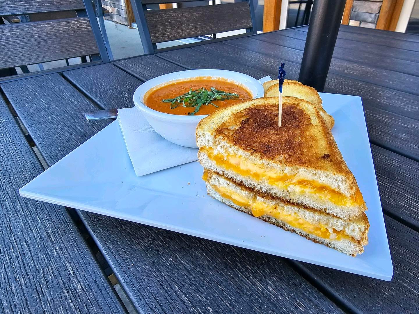 WEEKEND FEATURED SPECIALS
Special Available 12/22 & 12/23
We are Closed 12/24 & 12/25
Opened for Normal Hours 12/26
Kiss of Garlic Grilled Cheese
A la Carte Grilled Cheese with Aged Cheddar, American Cheese and a Dash of Garlic & Parmesan. Perfect for Pairing with our House Made Tomato Basil Soup. $7 / Add a Side to Make it a Meal
FRIDAY - Famous Fish Fry
White Street Kolsch Beer Battered Haddock, Pick Two: Fries, Chips, Coleslaw, Potato Salad, Macaroni Salad
Served with Lemon & Tartar Sauce $17.5
Substitution of Sides follow Normal Rules
(Cocktail & Malt Vinegar by Request)
SATURDAY - Cajun Shrimp & Grits
Blackened Shrimp, Nick’s Andouille Sausage, Tri Colored Bell Peppers & Cajun Cream Sauce set atop Stone Ground Grits with Cheddar Cheese. Small $17 (10 Shrimp) / Large $22 (16 Shrimp)
HOUSE MADE SOUPS
She Crab Soup $8 Cup / $9 Bowl
Tomato Basil $7 Cup / $8 Bowl
(Served with Crostini)