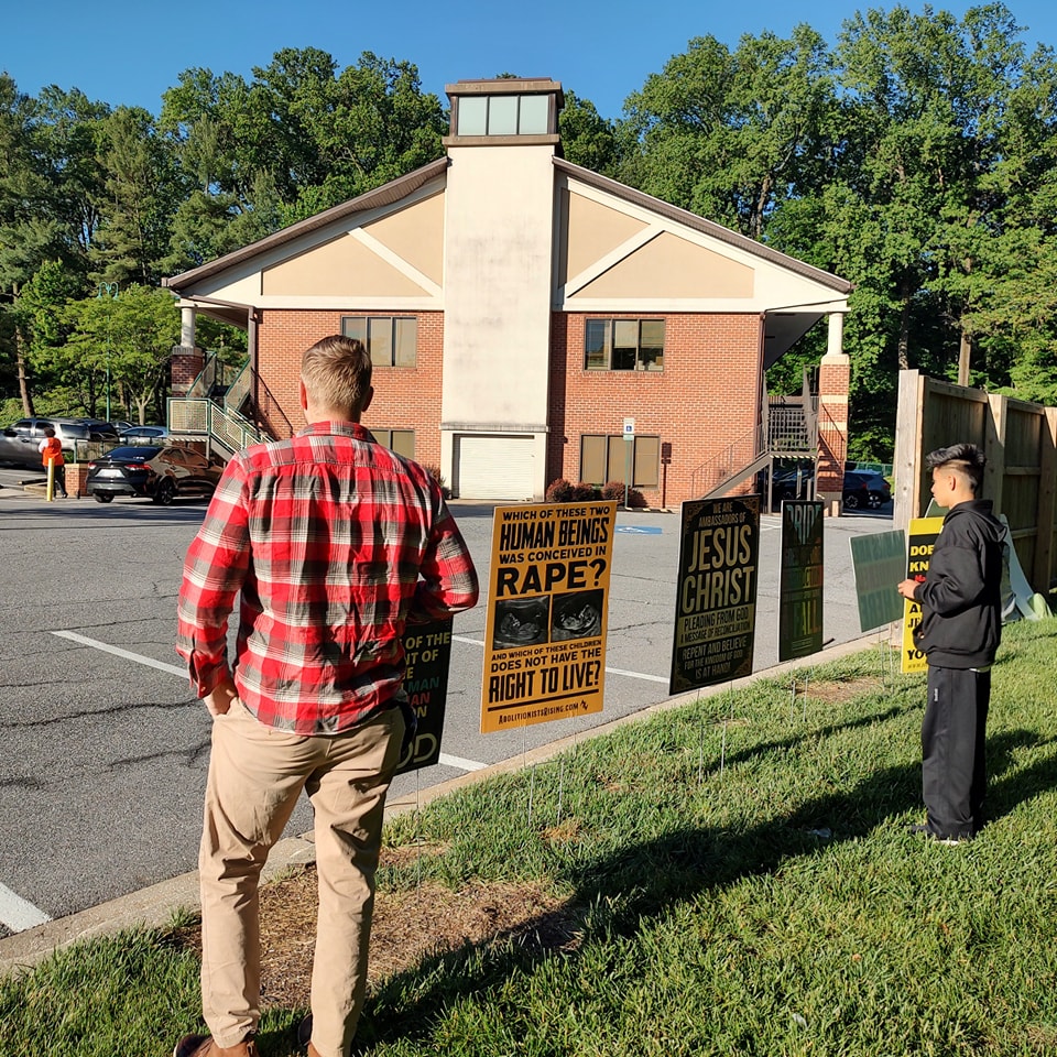 Pray as we evangelize at the abortion clinic here in Baltimore a lot of people are showing up and we're facing opposition.