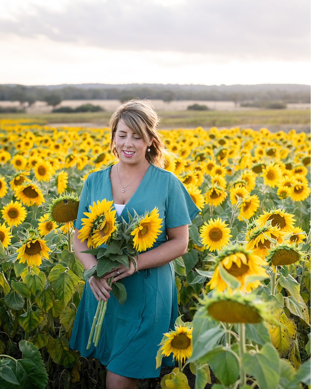 Have you ever stood in a field of sunflowers and just… paused?
Not rushed.
Not thinking about the to-do list.
Not answering emails.
Just standing there with the people you love, breathing it in.
That’s what this place feels like.
Every year I feel incredibly lucky that Laikin and her beautiful family open up their property and share this field with the community. The amount of work that goes into growing those sunflowers — and welcoming the hundreds of visitors who wander through — is huge. And Lakin? She’s an absolute gem. You can feel the heart behind it the second you arrive.
The smell out there.
The openness of the field.
The golden light stretching across what feels like endless flowers.
It does something to you.
The kids run.
The adults slow down.
Everyone softens a little.
These sessions aren’t just a quick photo shoot. They’re a full experience.
They’re a family day out.
They’re a Saturday afternoon date night in golden light.
They’re a solo self-care moment where you just exist in the sunshine.
They’re also perfect if you want to double it up and create beautiful content for your business while you’re there.
In a life that feels flat out most of the time, this is a pause button.
It’s a reminder of how lucky we are to live in this beautiful country, with locations like this right on our doorstep. A reminder that sometimes the best moments are the simple ones — standing in nature, laughing, holding hands, not checking your phone.
I could keep listing reasons to book… but honestly?
They’re sunflowers. Hundreds of them.
And the photos from past sessions speak for themselves 🌻 (Scroll through to see one of my favourite photos of me!)
Sunflower mini sessions are happening on Saturday March 14th.
One day only. Golden hour sessions.
They’re already over 50% sold, so if this has been sitting in the back of your mind… don’t wait. @pickyourownsunflowers
https://app.studioninja.co/booking//RYPJK09GM41509J9WH945EU8V