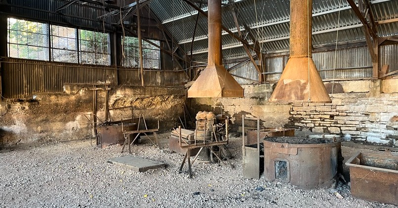 As part of the 2026 Community Stewardship Award spotlights, the Silver King Coalition Mine Headframe Building is recognized as a recipient of the Rehabilitation and Restoration award.
The Rehabilitation and Restoration award recognizes projects that demonstrate an understanding of a building's historical value, acknowledge the complexities of restoration, and approach the work with integrity. The Silver King project exemplifies these criteria. The building remained vacant for nearly seven decades and was listed on Preservation Utah's 2024 Most Endangered Sites. Structural instability from a collapsing mine shaft and a roof destroyed by record snowfall further complicated the project. Access was limited to a three-mile dirt road, restricting work to 16 to 20 weeks per summer. Furthermore, the complex ownership, easement, and approval processes required collaboration among the city, a ski resort, a museum committee, and multiple LLC entities before funding could be allocated. The Friends of Ski Mountain Mining History successfully addressed these challenges.
The Silver King Coalition Mine Headframe Building served as the centerpiece of Utah's most profitable mining camp. Between 1892 and 1953, millions of dollars in silver ore were extracted through a shaft exceeding 1,325 feet in depth, generating fortunes that influenced the state's development. Thomas Kearns constructed the mansion now known as the Governor's Mansion, David Keith became president of the Salt Lake Tribune, and Albion Emery's widow gained international recognition as Utah's Silver Queen. Following the mine's closure in 1953, the building was shuttered and remained untouched for nearly seven decades.
The project was conducted from June 2021 to October 2025. The mine shaft was filled with polyurethane foam, the masonry footings were encased, and an eighteen-inch concrete cap was installed. The 2022–23 snowfall caused the roof to collapse; the original corrugated metal panels were carefully removed, set aside, and reinstalled atop the rebuilt structure, preserving their historic patina. Over 1,600 window panes were removed, and century-old petrified putty was meticulously removed from their frames.