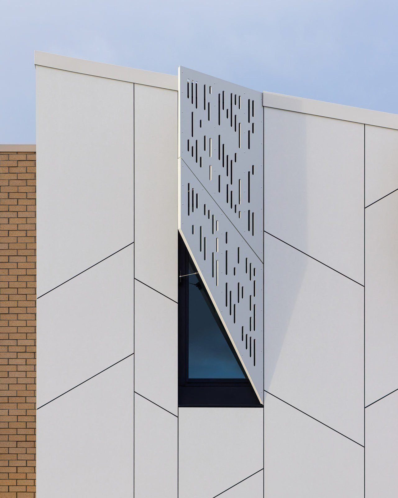 Swisspearl, designed to perform and detailed to stand out.
For the new Wellington Airport Fire Station, Swisspearl Carat panels in Ivory 7090 and Anthracite 7020 were selected not only for their clean, refined appearance, but also for their long-term durability. As high-density prefinished fibre cement panels, Swisspearl offers a low-maintenance façade solution with colours designed to retain their depth and consistency over time, ideal for civic and public-service buildings.
Designed by Designgroup Stapleton Elliott, the façade departs from the standard panel grid through angled horizontal joints and perforated fixed / solar shading screens that introduce movement, rhythm, and a more residential scale to the street frontage. White cladding appears to float above the brick base, while staggered panel layouts soften the length of the fibre cement walls without becoming overly dominant.
Installed on the PX cavity rail system using adhesive fixing, the façade achieves a clean, seamless appearance with no visible fixings, particularly suited to low-rise applications across both walls and soffits. The 12mm perforated panels are secured to SHS framing using colour-matched rivets, keeping fixings subtle while maintaining the crisp architectural finish.
Product: @swisspearl.group Carat facade panel
Contractor: @naylor_love
Architect: @designgroup_stapleton_elliott
Photography: @jasonmannphotography
A great result made possible through the collaboration and attention to detail from everyone involved across design, fabrication, and construction.
#CLADSolutions #Swisspearl #cladding #fibrecement #exteriorinspo