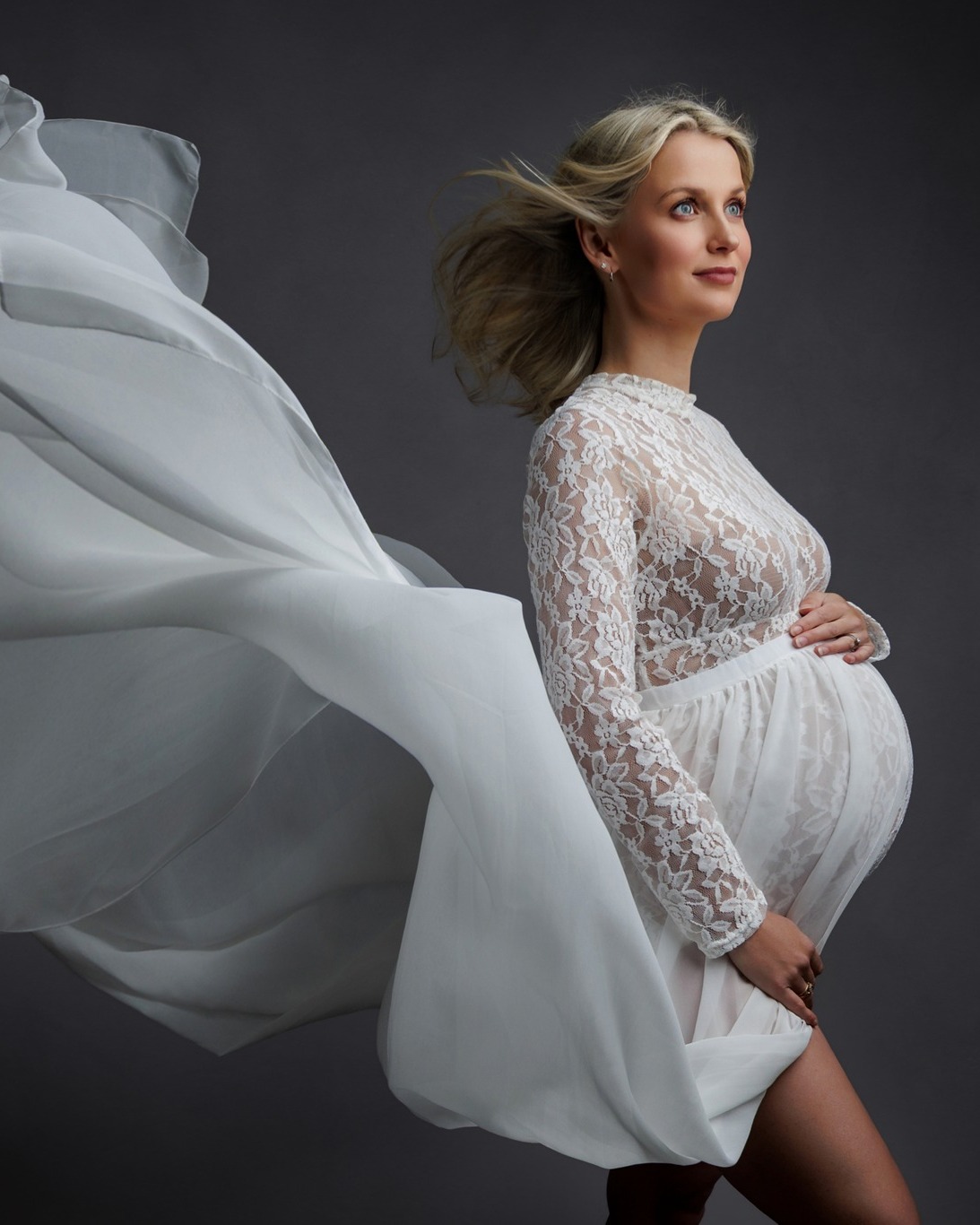 The white lace maternity outfit.
Soft, elegant, dramatic, floaty and just the right amount of “I am growing an actual human, please admire me accordingly.”
This is one of the outfits available in the studio wardrobe for maternity sessions, and it photographs beautifully with movement, wind, soft posing and that fine-art studio lighting I am mildly obsessed with.
It gives a lovely mix of delicate lace detail, flowing fabric and bump-showing drama without you needing to panic about what to wear. Because choosing clothes while pregnant is already enough of a full-contact sport.
Maternity sessions are all gently guided, so you do not need to know how to pose, what to do with your hands, or how to look ethereal on command. That bit is my problem. Tragically, I enjoy it.
Available to use for maternity photoshoots in my Portishead studio, near Bristol.