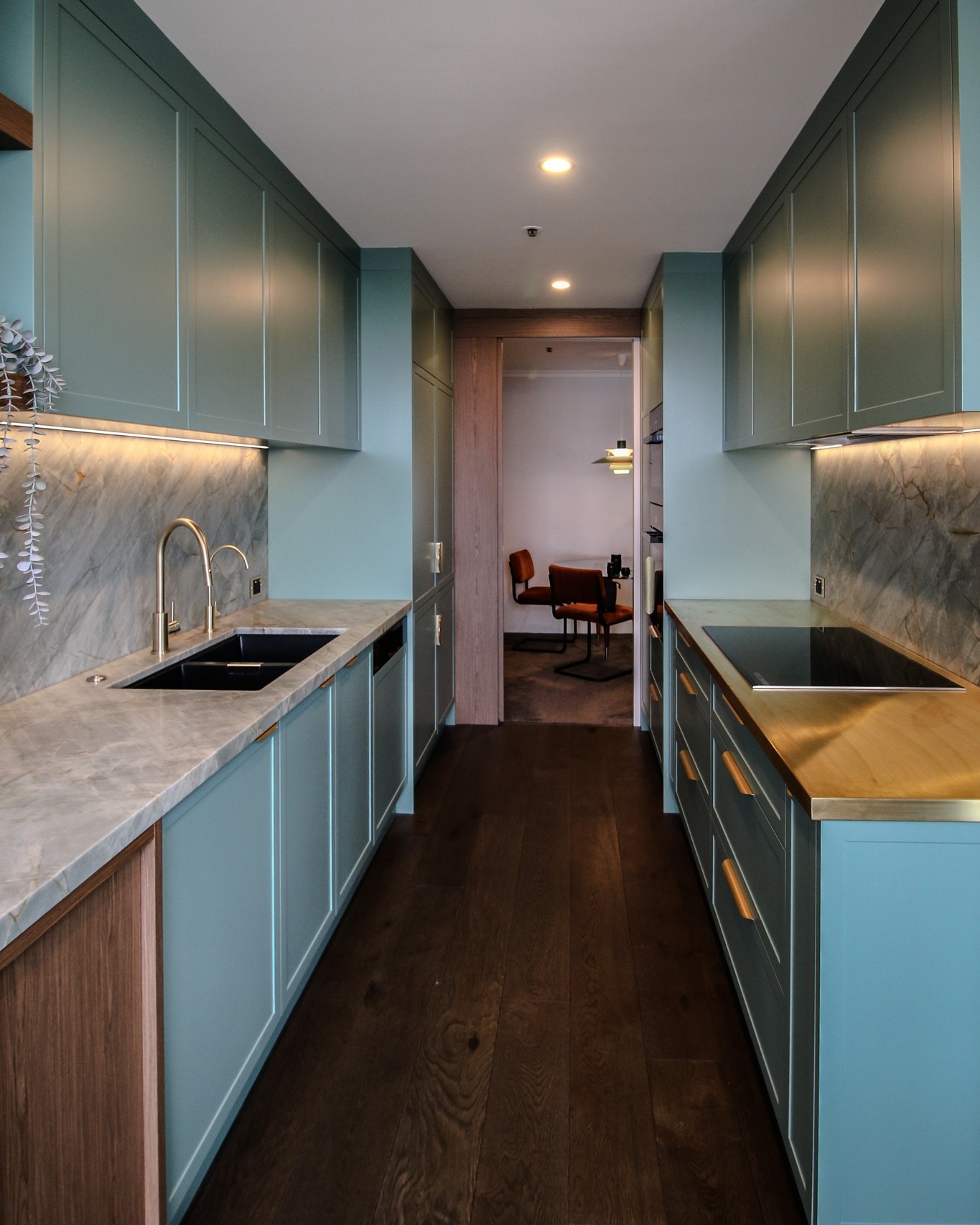 Project North Sydney / P.2 /
A refined balance of colour, texture and craftsmanship.
Featuring Shallow Shaker cabinetry in Dulux Jadeite Satin Polyurethane paired with Slab Eveneer Walnut in a clear matte finish, this kitchen brings together soft contemporary tones and rich natural warmth.
The Emerald Green Quartzite benchtops and Natural Brass detailing complete the palette, creating a space that feels both sophisticated and timeless.