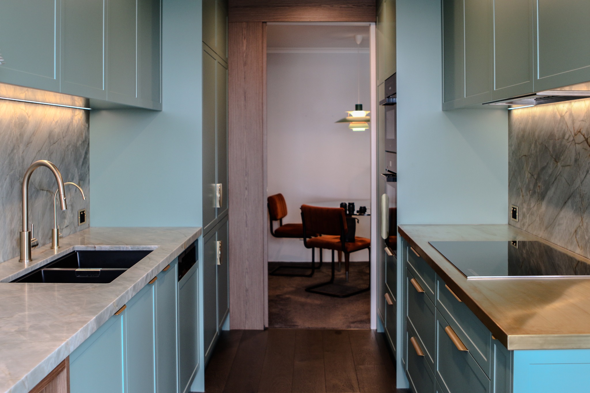 Project North Sydney / P.1 /
A refined balance of colour, texture and craftsmanship.
Featuring Shallow Shaker cabinetry in Dulux Jadeite Satin Polyurethane paired with Slab Eveneer Walnut in a clear matte finish, this kitchen brings together soft contemporary tones and rich natural warmth.
The Emerald Green Quartzite benchtops and Natural Brass detailing complete the palette, creating a space that feels both sophisticated and timeless.