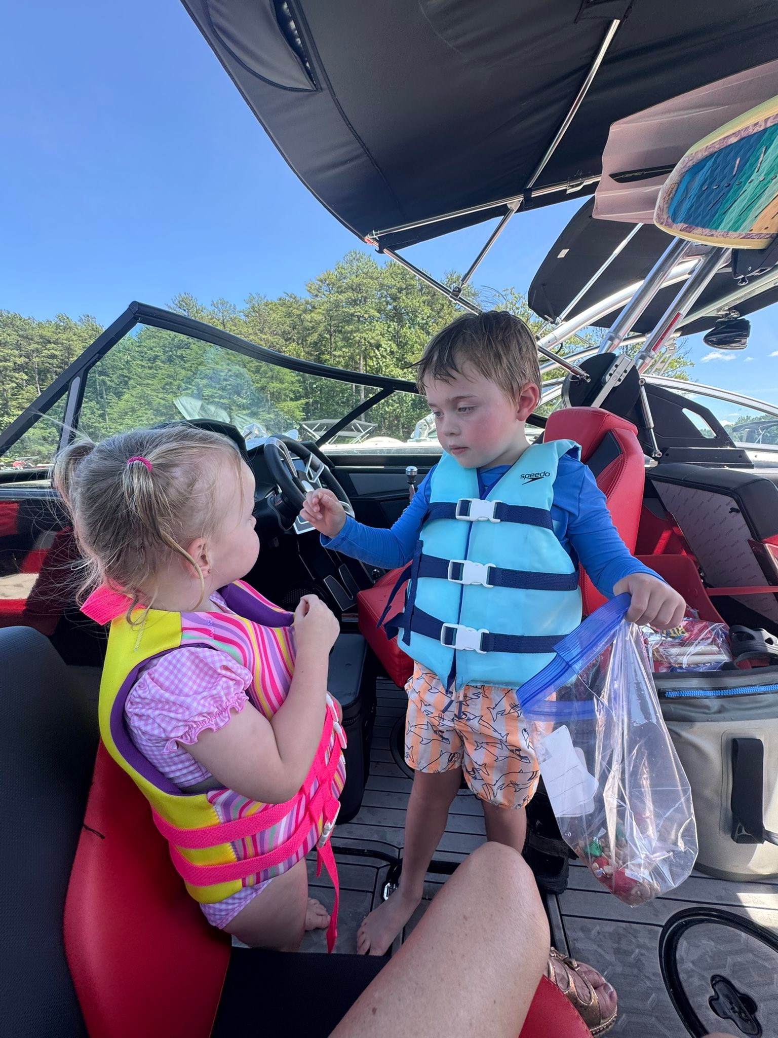 THIS deserves a post of its OWN 😂
so I asked Charlie Millie if they wanted to pack a snack for the boat ride, they said sure!
So I went to the fridge and got up some cheese sticks, got out some crackers, and some healthy snacks…….
MEANWHILE…… Charlie goes to the CANDY drawer and packs THESE …….. 🤣
To note- it was Hershey kisses and Reeces chips
Also to note- they got what they wanted at Jojo’s ❤️✅🤪