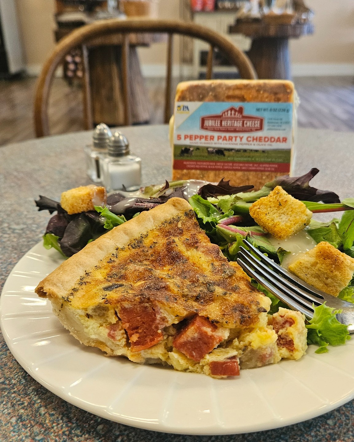 Did you try the June quiche special at @crackedpot_coffee yet?
It's charcuterie quiche featuring pepperoni, kalamata olives, salami, and 5 pepper party cheddar. What you see is what you get! Each bite had a piece of charcuterie or olive and delivered big flavor - savory, sweet, salty, and a hint of spice from the cheese.
The 5 Pepper Party Cheddar from @jubileeheritagecheese won in the flavored cheddar category at the PA Farm Show five years ago. If it was that good then, imagine what it's like now! As it's aged, it has become sharper and spicier (from the cayenne on the rind), while still delivering the flavor of the peppers throughout.
The quiche is available at The Cracked Pot in Carlisle and Mechanicsburg through the end of June. The cheese is available in our shop downtown Carlisle.