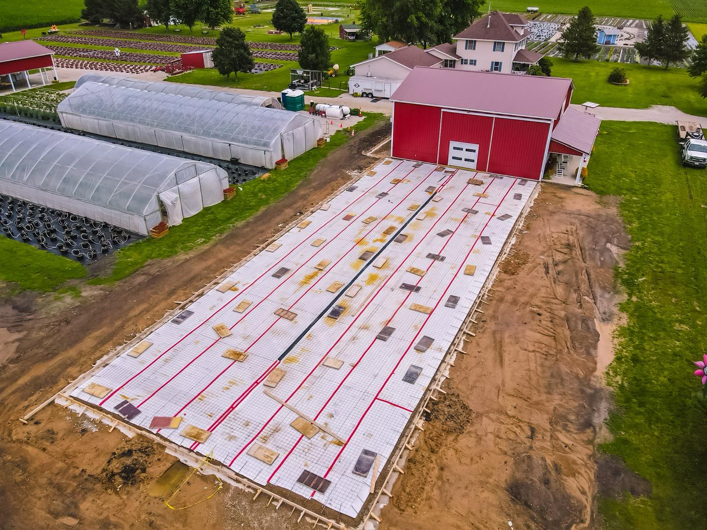 Mother Nature has been keeping us on our toes and throwing a few curveballs at our 2026 plans! We’re doing our best to outsmart her, but for now, we’re waiting for things to dry out a bit before the concrete can be poured for our new greenhouse.
We’re excited to watch this project take shape and can’t wait to share it with you! Thank you for your patience as we put a temporary detour in place to access the strawberry houses during construction. 🩷