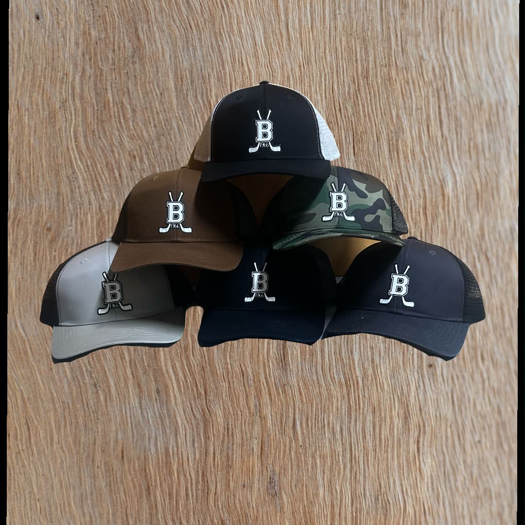 Some hats for old hockey boys getting together for a round of golf.