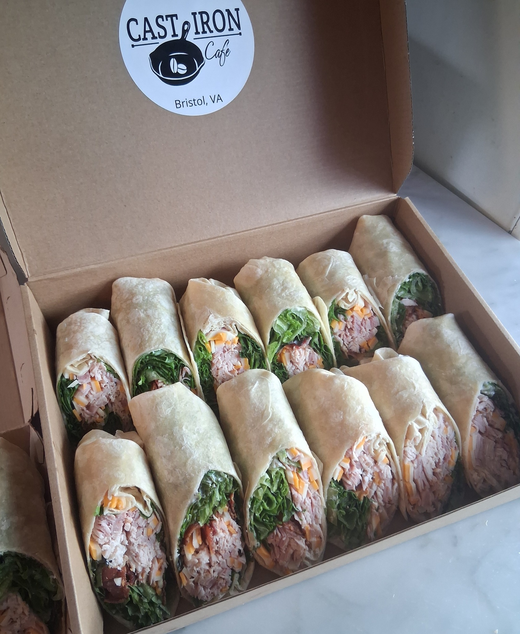Catering order headed out: Club Wrap Tray
Freshly sliced black forrest ham and real turkey breast piled high with strips of bacon, cheddar and swiss cheese, spring mix and our signature aioli
Add on a gallon of tea, a box of cookies, chips or our deviled egg potato salad
To order:
📞call: 276-285-2200
💻email: info@castiron-cafe.com
🚗stop by: 1386 Old Airport Rd. Bristol, VA