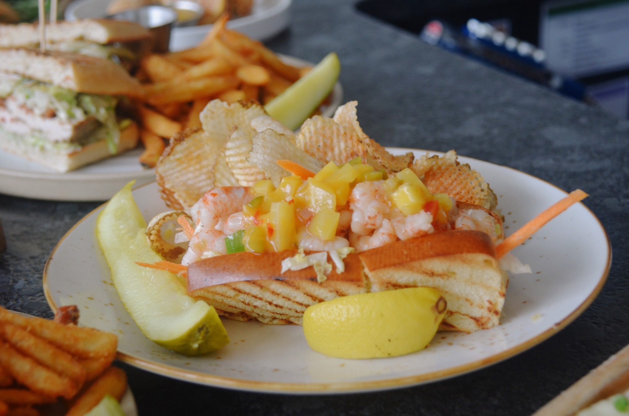 Meet your new lunch favorite. 🔥🦐
Our Spicy Shrimp Salad Roll features tender shrimp tossed with sweet chile sauce, topped with a crisp jicama and carrot slaw, finished with mango chutney, and served on a buttery New England-style brioche bun.