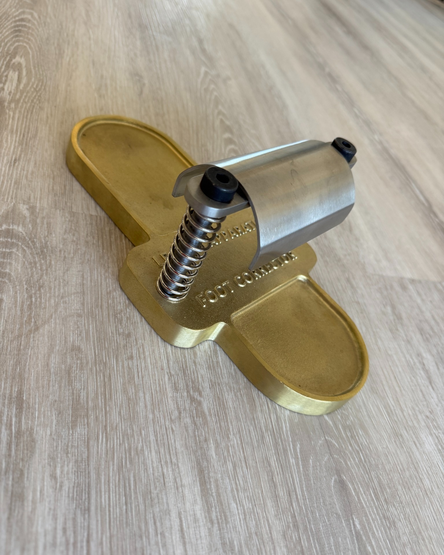 THE SMALL PROPS - PART 1!
In addition to the large apparatus, Pilates uses a variety of small props to improve strength, alignment, body awareness, and movement quality. Many of these were designed by Joseph Pilates, while others were added later in contemporary practice.
The Foot Corrector is a small device with a spring-loaded pedal. It was designed by Joseph Pilates to strengthen and mobilise the feet and ankles. Exercises involve pressing the spring with different parts of the foot while maintaining proper alignment through the rest of the body.
The Neck Exerciser is much less common in modern studios, it was designed to strengthen the muscles of the neck, improve posture, and support healthy spinal alignment. It’s typically used with the cadi/wall unit and consists of a padded headband, a spring and a harness that provides resistance. The Neck Exerciser was developed to strengthen the muscles that support the head and cervical spine.
The Magic Circle (also nicknamed ‘The Ring of Fire”) is a flexible ring, usually about 14–15 inches in diameter, with padded handles on either side. The ring can be squeezed or gently resisted using hands, knees, ankles or thighs. The ring doesn't create heavy resistance; instead, it encourages controlled muscle activation and precise movement.
Did you know…..Joseph Pilates originally made the first versions from the metal rings that wrap around beer kegs?
Tomorrow we meet the other half of the small props team!