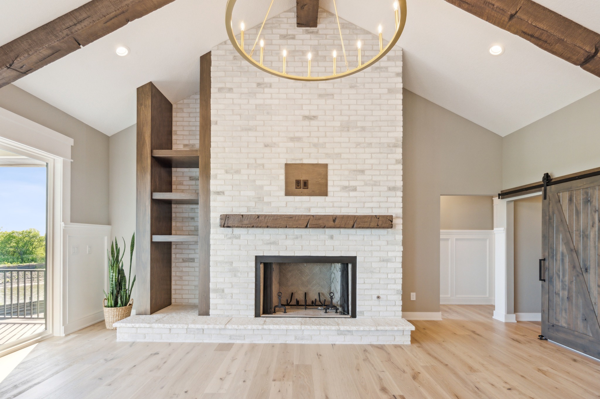 A living room with character.
From the white brick fireplace and reclaimed wood mantel to the exposed beams, custom built-ins, and oversized sliding barn door, every detail in this space adds warmth and personality.
The vaulted ceiling brings in an incredible sense of openness, while the natural wood tones and soft finishes make the room feel welcoming and comfortable.
This is what makes a custom home so special — the details come together to create a space that feels uniquely yours.
Thoughtful design. Beautiful craftsmanship. A home built around the way you live.
-
-
-
Berkey Homebuilders Inc.
515-967-3136
admin@berkeyhomebuilders.com
www.berkeyhomebuilders.com
1000 9th NE, Altoona, IA, 50009