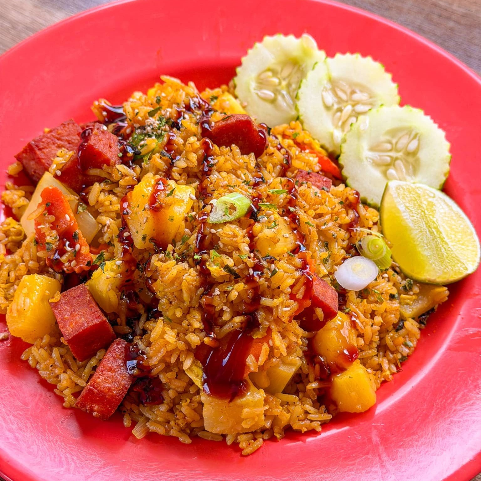 🍍𝐇𝐚𝐰𝐚𝐢𝐢𝐚𝐧 𝐅𝐫𝐢𝐞𝐝 𝐑𝐢𝐜𝐞🍍
Starting this week! Hawaiian Fried Rice is on the menu. It’s bright, bold and filled with tropical flavor.
Flavorful curry-spiced fried rice is tossed in a wok with diced spam, pineapple chunks, onions, carrots, scallions. Drizzled with a sweet soy glaze and topped with furikake seasoning.
It’s got it all: salty, savory, sweet, spicy, tart, citrusy and TONS of umami flavor.
𝐓𝐡𝐞 𝐈𝐧𝐬𝐩𝐢𝐫𝐚𝐭𝐢𝐨𝐧: a love letter to Hawaii
This week’s special is inspired by both our siblings trip to Japan last year and our family’s personal history living in Hawaii for a time when Grandma and Grandpa first immigrated to the US.
🌺 The beauty of Hawaiian culture and her food lies in a deep connection with the land, a gratitude for the resources it provides, and a strong sense of community.
This harmonious way of living resonated deeply with our family’s roots to our home country of Laos in Southeast Asia. 🇱🇦
After Hawaii, we moved to Texas and then ultimately settled here in Wisconsin.
We’d always jokingly roast Grandpa for generationally signing us all up for these brutal Midwest winters over the beachy paradise of Hawaii 😂😭
But he and Grandma truly fell in love with the natural wonders of Wisconsin. The land here provided abundance in a different way: fishing in the freshwater rivers and lakes; hunting and foraging in the woods, and friendly communities too.
Japanese-Hawaiian fusion cuisine, like our Laotian-Midwestern menu, tells a significant story. One that all of our grandparents have most likely lived through and taught us: 𝘳𝘦𝘴𝘰𝘶𝘳𝘤𝘦𝘧𝘶𝘭𝘯𝘦𝘴𝘴. Using the ingredients you have, adapting, and creating something out of nothing.
We hope you’ll savor this dish with a sense of wonder and significance too. Even better: alongside family, a friend or even a neighbor.
✨ Available exclusively this week for dine-in and takeout while supplies last.
See you soon!
With gratitude,
The Sweet Basil Family & Staff