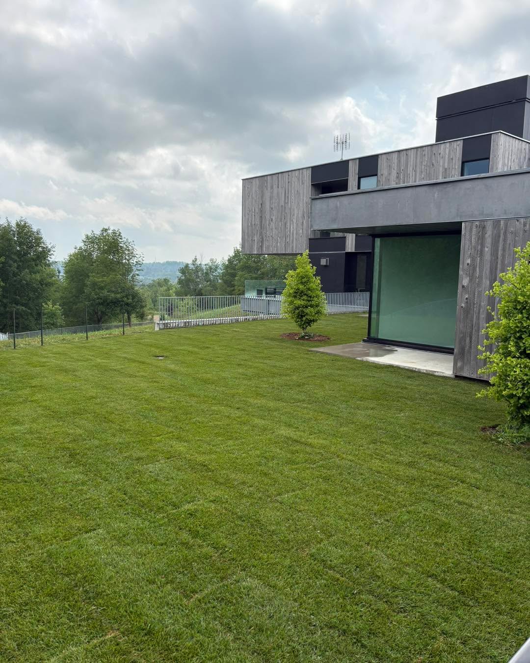 These amazing customers in Alton have a newly built rural home, but needed a fresh new area for their new puppy to run around. We created a 2,200 square foot area by removing some of the extremely rocky existing soil, adding 12 cubic yards of fresh 50:50 mix as a base, and 290 rolls of fresh Kentucky Bluegrass sod. Rolled, watered, and with proper aftercare it should be ready to rock in 3 weeks or so.