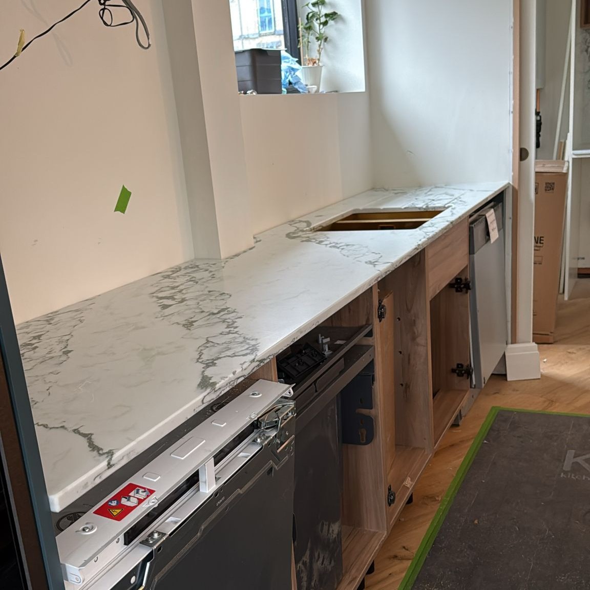 Corchia Uffizi 20mm quartz worktops with mitred waterfall island end panels, larder tops and splashbacks fitted in Chorlton #homeimprovement #quartzworktop #worktopscheshire #quartzworktops #kitchenideas