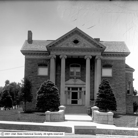 For years, people wondered what would happen to the O.J. Salisbury House. Now, the corner of 600 East and 100 South is alive again.
Built in 1898 by well-known Salt Lake architect Frederick Albert Hale, this landmark is a great example of Neoclassical design. The main facade features warm sandstone, a grand portico, tall Ionic columns, and a decorative pediment. The central doorway is framed by a broken pediment and columns, with transom glass and two oval windows above. Segmental windows with stone keystones and a metal cornice with brackets finish the look.
Every detail was designed to impress, and now, after years of uncertainty, it does once more. The house has been restored and now serves as an assisted living community. Old buildings have stories, and it’s great to see them continue.