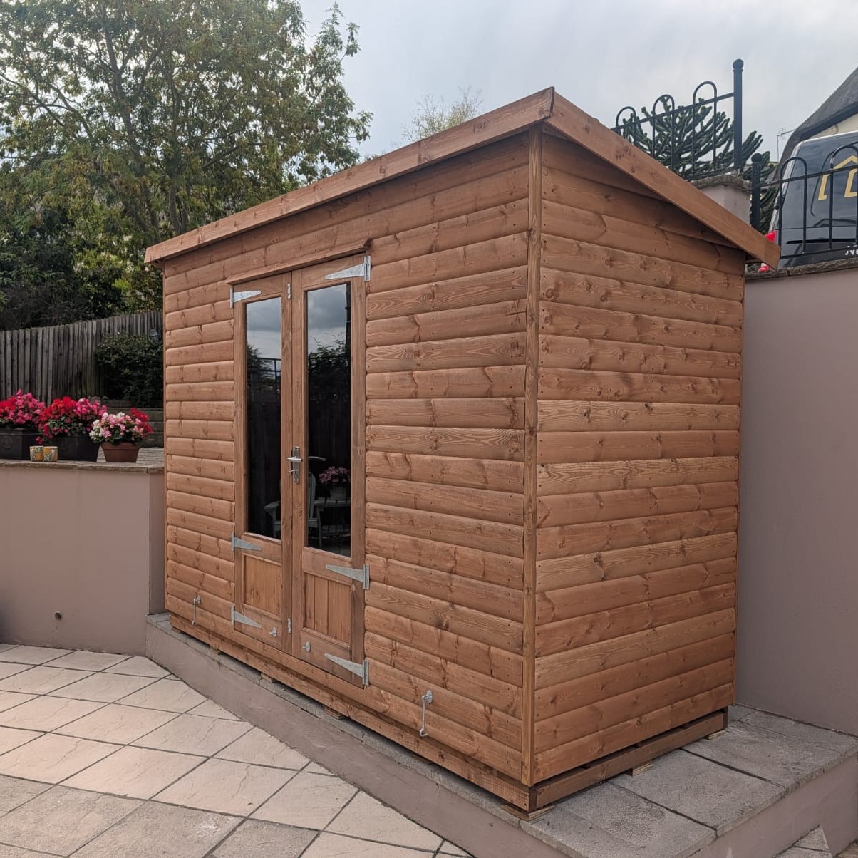 10' by 4' Pent Shed in Log lap, delivered and erected last week with summerhouse doors, on a bearer base.
https://www.halstocksheds.co.uk/