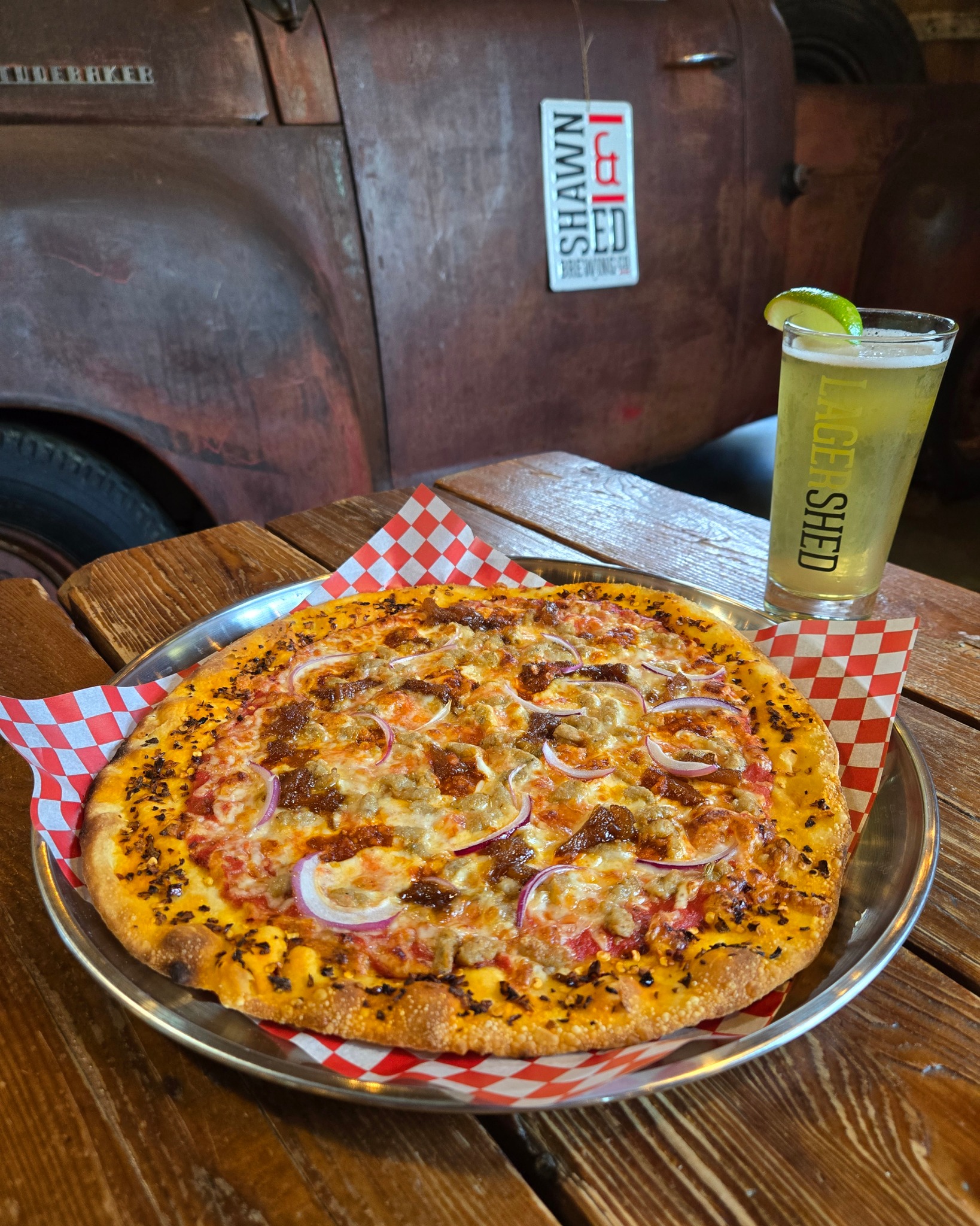Saguaro has entered his pizza era. 🍕🌵
This week’s Beer Pie is inspired by our resident googly-eyed cactus himself: The Saguaro. Chili flake crust. Sausage crumble. Red onion. Sweet pineapple chutney. Sambal oelek. Mozzarella. Maldon salt.
A little sweet. A little spicy. Very SHED. Best enjoyed with a Salted Lime Cerveza because even a cactus needs a cold one. 🌵🍺