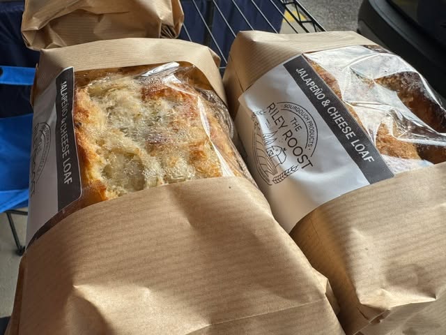 Today, we are spotlighting our vendor, Riley Roost Bakery. Let us introduce you to Lindsey from The Riley Roost Bakery, a sourdough cottage micro bakery offering naturally leavened, long-fermented sourdough goodies — from hearty loaves and flavorful focaccia to pizza crusts and scones!
At The Riley Roost Bakery, they believe real food has the power to transform health. That’s why they use only quality ingredients (organic whenever possible). Sourdough is beautifully simple — just flour, water, and salt — with no preservatives, stabilizers, or artificial nonsense.
When you enjoy their bread, you’re making a healthier choice:
Lower glycemic index
Easier to digest
Naturally fermented
Next time you’re in the grocery store, take a peek at the bread aisle… 17+ ingredients on a single loaf?! Once you join the real-food revolution, you’ll never go back to crummy grocery store bread!
Favorite market picks:
Jalapeño Cheese Bread
Coffee & Dark Chocolate Sourdough Scones
Lindsey first started baking sourdough during COVID — and never looked back! Now, she brings her passion and loaves of love to the Hall County Farmers Market each week. She says her favorite part of the market is you — the wonderful customers who share what tasty meals they create with her sourdough.
Buying local matters! Did you know that for every $1 spent at a locally owned business, $0.73 stays in our community? Shopping small keeps money local, supports local jobs, and strengthens our Gainesville-Hall County economy.
Pre-order online: www.therileyroostbakery.com
Follow @the_riley_roost_bakery
Find them on Facebook: The Riley Roost Bakery