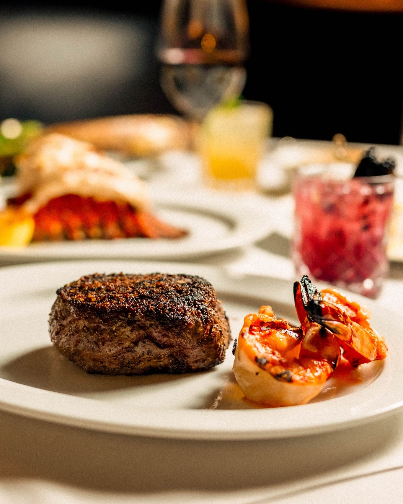Your steak, exactly how you want it, that's the whole idea behind our toppers.
This filet is finished with three colossal black tiger shrimp, seared until the edges char and glazed just before it hits the table.
It's one of six toppers on our menu, alongside options like king crab, seared foie gras, and truffle butter.
Which topper is non-negotiable for you?
📍 Uptown Dallas | Reserve via link in bio.
#NickAndSams #DallasDining #UptownDallas #DallasRestaurants