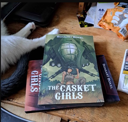 The paperbacks are starting to look real. ⚙️
I recently ordered print-on-demand versions of The Casket Girls #1 and its variant cover, and I really love how they turned out.
The dark edges around the pages give the book an excellent black exterior.
The eventual versions should look even better.
And once the interior illustrations for Book Two are finished, I will share a preview of those as well.
Follow the Kickstarter before the engines start:
https://www.kickstarter.com/projects/bonsartbokel/casket-girls-2-steampunk-mecha-chronicles-continue
#steamptember @steampunksardegna #TheCasketGirls #PaperbackBooks #SteampunkBooks #Kickstarter #IndieAuthor #CosmicMystery #AssociationOfIshtar