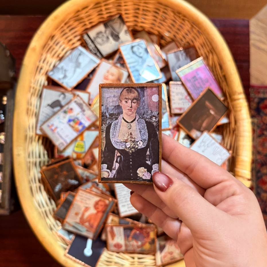 These handmade magnets are perfect for adorning your fridge with vintage ephemera! 📚
Locally created by artist Chayli Richardson, we have both her magnets and coasters in stock for you to dig through!
Come support local creators today and score something cool, too! 😍