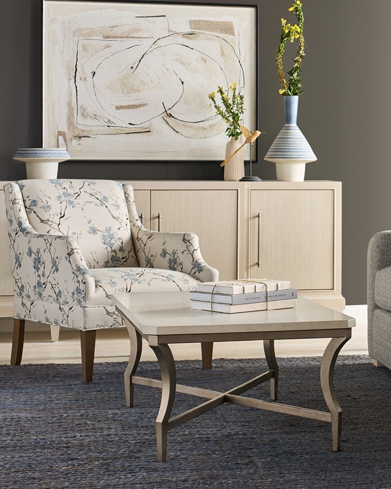 BIRCHHAVEN COCKTAIL TABLE | $1,199.95
The Birchaven Cocktail Table is defined by a cool, expansive White Quartz stone tabletop, designed as the quiet jewelry for the modern living space. The dramatic stone surface rests upon a gracefully curved frame in the subtle Aged Pewter finish, forging a balanced, refined statement.