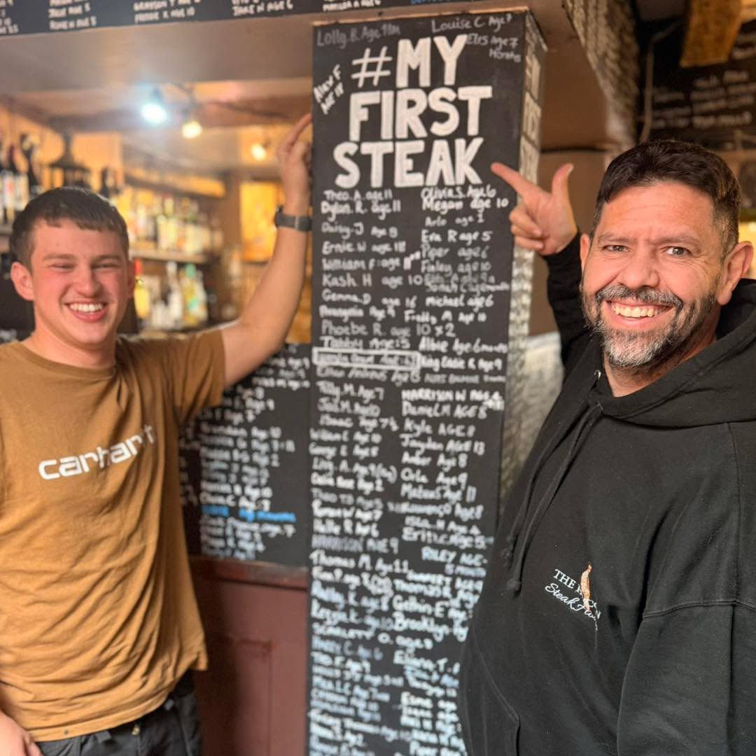 A big congratulations to 18-year-old Alex, who not only made his first visit to The Falcon Steakhouse today (despite living just up the road!), but also had his first steak EVER! 🥩👏
So naturally, his name has gone up on our famous My First Steak board!
Now, this board is usually reserved for children, but Alex certainly isn’t the first adult to make it on there. We’ve even had a lady in her 60s come in for her first ever steak!
18 years without a steak! We’re not quite sure how he’s managed that,especially under the shadow of the Falcon...but we’re glad he chose us to put that right!
Hopefully the first of many, Alex! Thanks for choosing The Falcon for your first steak! 🥩❤️
know anybody who has yet to have their first steak? Put that right by clicking the link below.
https://www.falconsteakhouse.com/book-now/