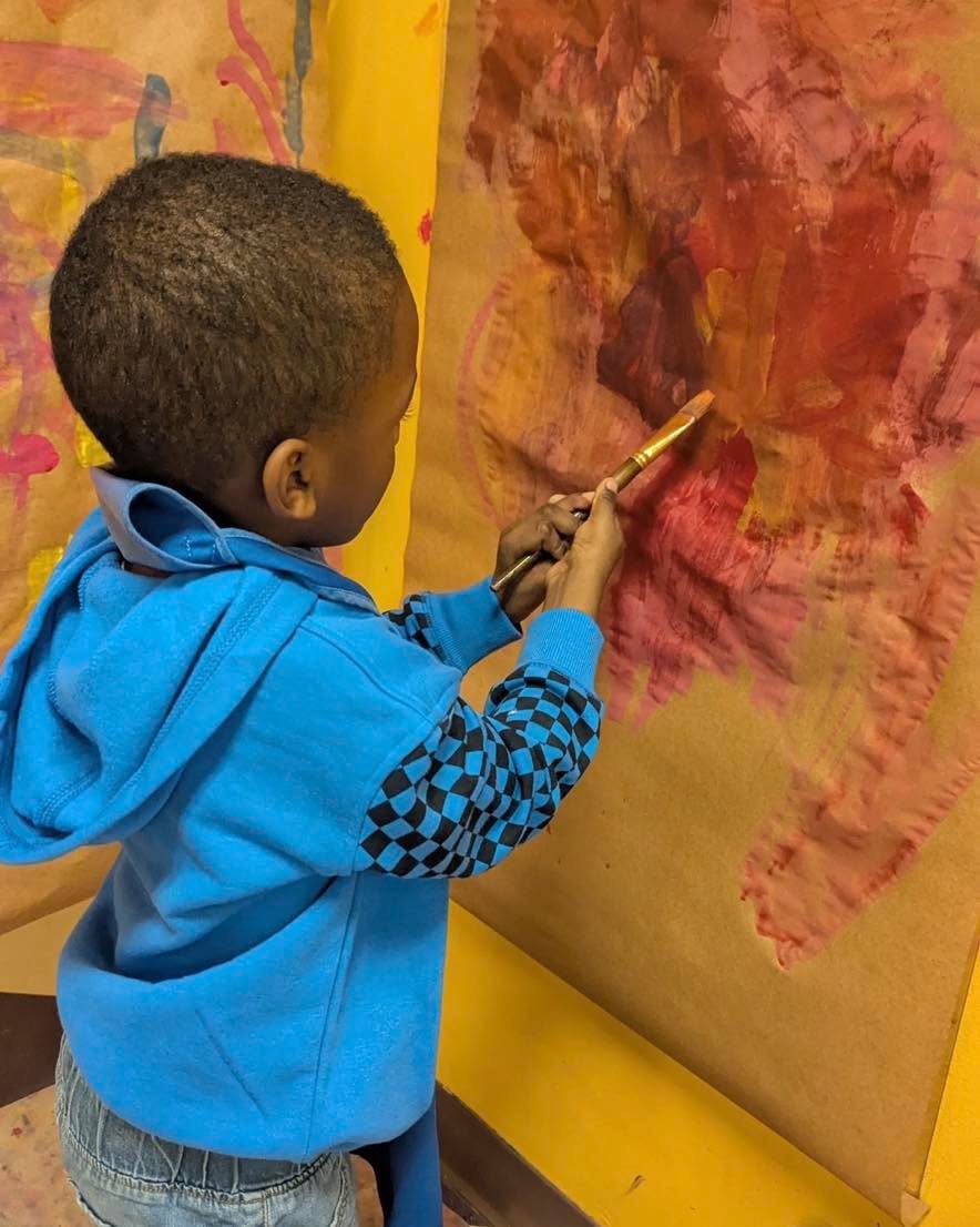 From a parent: I have so many beautiful scrolls of paper that my child has painted on at school.
It’s a surprise every time, some days it looks like the colors of a sunset, others more subdued, sometimes I see faces or different scenes. I am always in awe that my child is in an educational space that she can express herself through art. What a blessing to see.