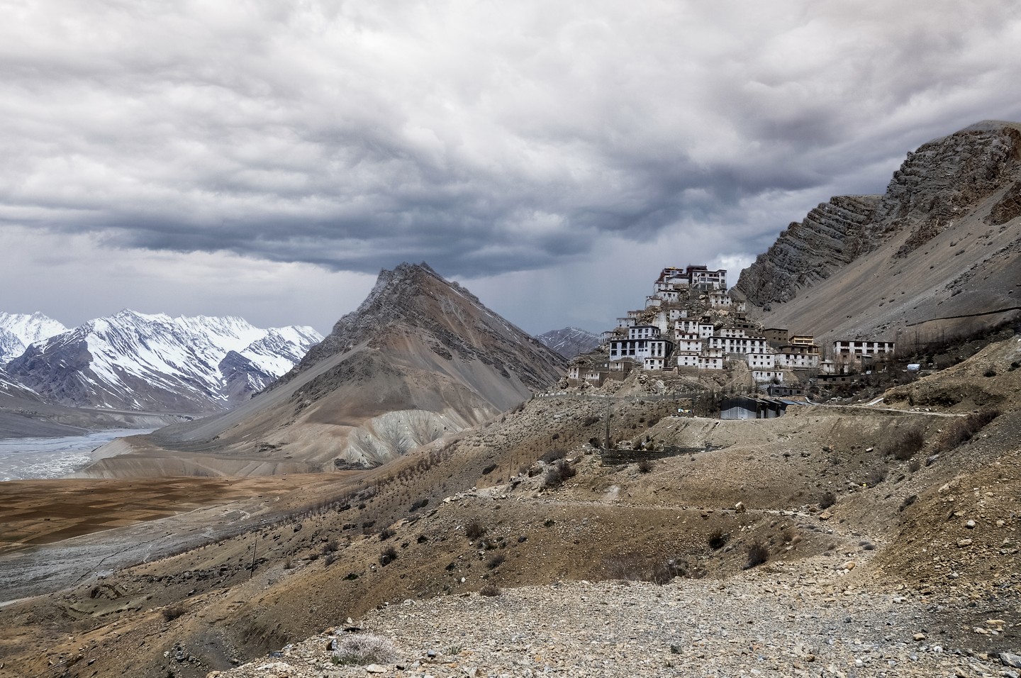Journal entry from May 5th,2011 at Key Monastery in India. (more on my website blog)
Key Monastery is an ancient monastery in the Spiti Valley, a high-altitude desert valley cut off from rainfall and the outside world by soaring mountains and treacherous roads in the state of Himachel Pradesh, North India.
I stayed here overnight while trekking through from Kibber to Kaza. Tea and meals with the monks was so much fun.
We were called to meals and tea by the
sound of a conch shell horn. One of the younger monks showed us many of the sacred inner rooms of the monastery which housed thousand year old scriptures and Thangkas (Tibetan paintings) which had been brought over from Tibet over the last thousand years. Some rooms were so sacred that outsiders were not even allowed to look in, which I really like because it leaves some mystery, which there ought to be in a thousand year old temple deep in the Himalayas The monks take their meals in an ancient kitchen, along one wall there are big stone wood fire stoves. On top of the stoves, huge blackened metal pots 3 feet across and two feet deep are used to cook for the 300 monks that stay at Key. A few of them had been learning English and loved having someone to teach them. Having already been an English teacher many times in the past I felt right at home.
My time at key monastery was definitely an unforgettable experience. I think someday I will return and spend some more time there. I can only hope it doesn't change too much.