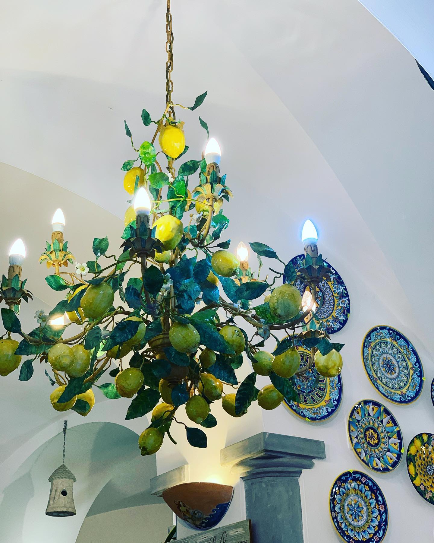 Donāt mind if I do⦠how is this beauty for a statement light!? Of course the ceramics in the background are pretty fabulous too. Beauty everywhere in Positano and itās not just on the beaches. #lightinginspiration #ceramicloversššš