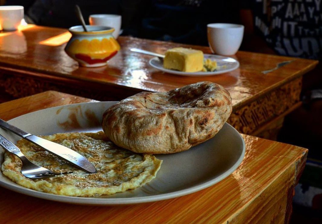 TRAVEL STORIES FROM LADAKH
.
.
"Before we started off with our Day 1 itinerary, a sumptuous breakfast platter with Khambir (Ladakhi bread), omelette, tea and dollops of butter savoured our tastebuds.”
.
.
Courtesy @twoirregular 
#ladakhbackpackers #travelholic #nubravalley #backpacking #reels #trendingreels #lehladakh #backpackers #trending ##wanderlust #spiritualawakening #instagram #nikonindiaphotography #ladakh #likeforlikes #backpackertrails #ladakhdiaries #followforfollow #adventurelover #himalyandiaries #himalayas #ladakh2022 #incredibleindia #shotoniphone #travelphotography#incredibleindia #follow4followback #instalike #instagood #instamood