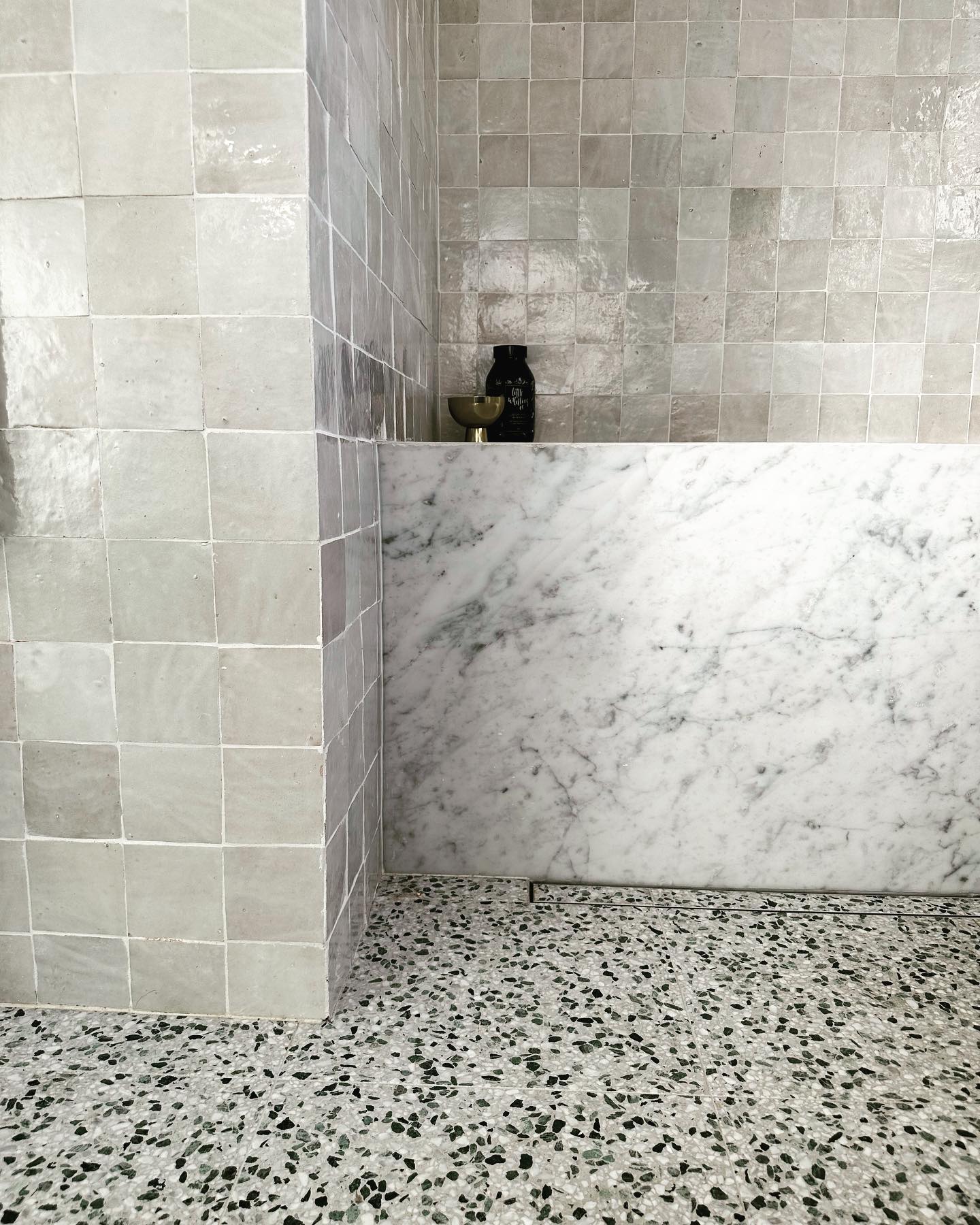 Layered Neutrals ||
Such a thrill to see this client bathroom come live after we collaborated on the tile selections and arrived at this beautiful layered neutral palette. The starting point was the beautiful terrazzo floor tiles @fibonacci_au with support from the hand made Moroccan zellige tiles. Zellige tiles are kiln-fired over olive branches, giving each tile a unique glaze, colour and texture. No two zellige tiles are exactly alike so they combine on the walls to create a unique tapestry of soft colours and delicate texture. Finally the icing on the cake was the beautiful Carrara marble - with its soft grey veining shown here on the front of the bath and repeated on the vanity top. #sopretty #sydneyinteriordecorator #bathroomdesigner #northshoredesigner #bathroommakeover #sydneybathroomdesigner
