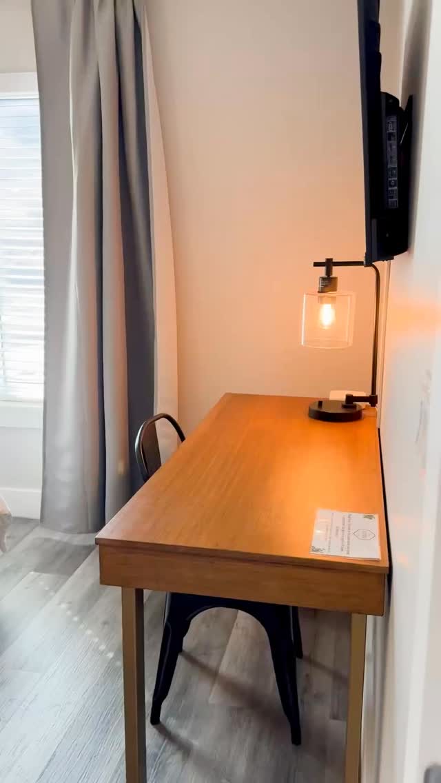 This cozy corner has everything you need: a sleek desk setup, wireless phone charger, personal fan, reading lights, custom art, and bedding so comfy you’ll never want to leave.