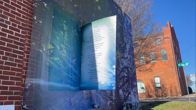 A wind collaboration with the Poetry Wall exposing @naryawithwings poem with @scottowenspoet Opening like a book . #studiolightandspace #artscatawba #ncartist #afternoonlight #poetrywall wall