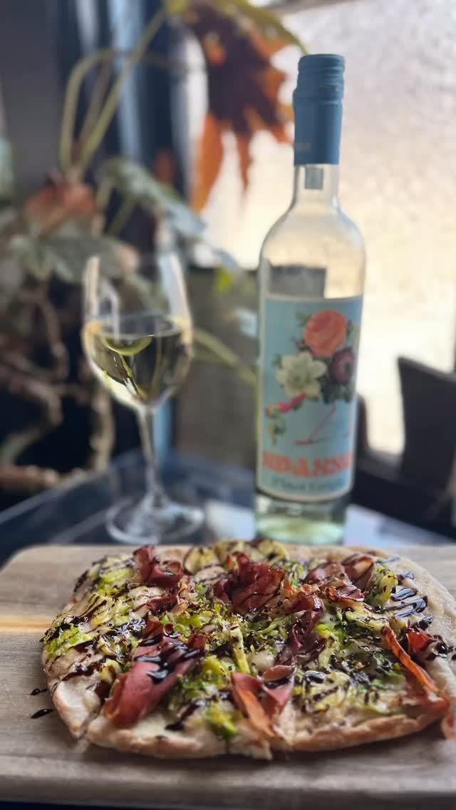 New flatbread this week! Your favorite, loaded brussel sprouts seen here with our new #sturgeonbay #destinationdoorcounty #doorcountyrestaurants #doorcounty #doorcountywi Pinot Grigio.