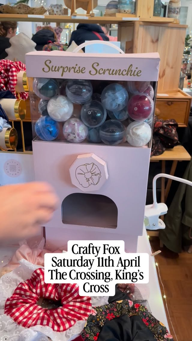 The Itsy Bitsy Teenie Weenie Scrunchie Vending Machiney will be coming with me to @craftyfoxmarket on Saturday! This might be my favourite part of my stand (although I will also be offering free foil initials on bookmarks in person too so there’s a strong contender for new favourite market thing!)
It’s just £5 a turn and you’ll receive a surprise mini or classic size scrunchie!
Video description- A hand turns a wheel on a cardboard vending machine which dispenses a plastic capsule with a red silk scrunchie inside. Text over the top reads Crafty Fox Saturday 11th April The Crossing, King’s Cross