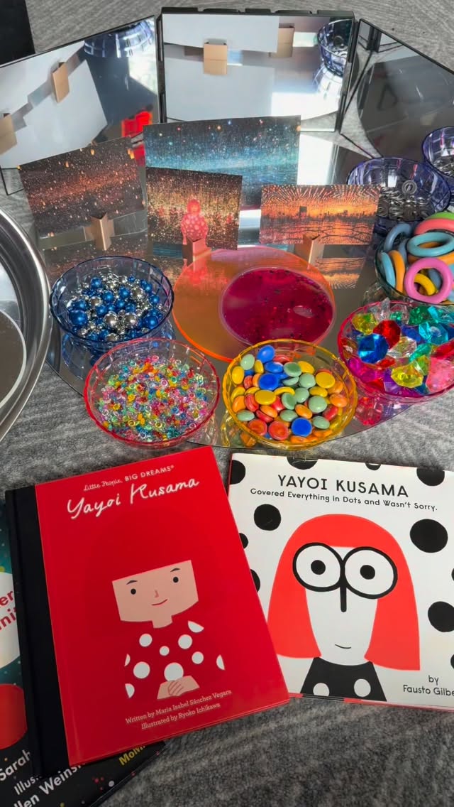 Mini Infinity Rooms Inspired by Yayoi Kusama// We stepped into a world where space stretches endlessly & reflections linger, unfolding into infinity. Inspired by the luminous work of #YayoiKusama, the Infinity Mirror Rooms transcend traditional art experiences. First introduced in 1965, these immersive environments use mirrors, light, & repetition to dissolve boundaries, blurring the line between self & surroundings. Rooted in Kusama’s exploration of infinity, self-obliteration, & interconnectedness, the rooms invite each viewer into a quiet confrontation with scale, presence, & belonging. Within these mirrored worlds, one becomes both observer & participant, at once small, & yet part of something immeasurable.
Inspired by @100languagesatelier, we reimagined this experience through the lens of the child. Mirrors, loose parts in our @discountschoolsupply Translucent Sorting Tray, & gentle light sources came together to create “mini infinity rooms,” spaces where curiosity leads & imagination unfolds. Here, children encounter endless possibilities, where a single object becomes many, & perspectives shift with each movement, each gaze, each discovery.
Alongside this visual dialogue, loose parts offer a language of their own. In the hands of a child, materials are transformed, arranged, combined, revisited, & reimagined. This open-ended exploration supports fine motor development while also nurturing creativity, emotional expression, & a deep sense of agency. Each placement becomes intentional, each creation a trace of thinking made visible.
Together, light, reflection, & material become co-constructors of meaning. They invite children into the hundred languages of expression, where ideas are not only spoken, but seen, touched, & felt. Within these spaces, children are not simply observing the world, they are in relationship with it, constructing knowledge through wonder & discovery. #tinkerwonderplay #loosepartsplay #loosepartsexplorartion #arteducationmatters