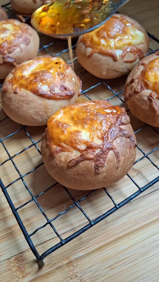 Hot Honey Cheese Buns
You can find the recipe for these delicious bites of joy below!
375g flour
10g sugar
8g yeast
8g salt
200ml milk
45ml oil
1 egg
50g butter melted
50g mozzarella cheese (or use a mix of cheddar and mozzarella)
50ml honey
1/4tsp chilli flakes
Dash of hot sauce
Mix all the ingredients together and knead for 10 minutes.
Place in a bowl, cover and leave to rise for 1 hour or until doubled in size.
Divide into 12 equal pieces and roll into balls.
Dip each ball in the melted butter, Place on a baking tray and use the back of a measuring spoon or something round to create an indentation in each roll.
Fill with the cheese and bake for 20 minutes.
In a saucepan bring the honey, chilli flakes and hot sauce to a simmer, remove from the heat and drizzle over the warm buns.
Enjoy!
Welcome to Joy as it Flies, your cosy corner for creative living! Join us for delightful 'cook with me' vlogs and easy-to-follow recipes that bring joy to your kitchen. We also share our passion for fibre arts, offering inspiring sewing vlogs, practical tutorials, and beautiful crochet patterns and guides. Whether you're a seasoned maker or just starting your creative journey, find inspiration for food, lifestyle and fashion, and experience the joy of creating from scratch alongside us!
#joyasitflies #cheesebread #hothoney #goodfood #recipe