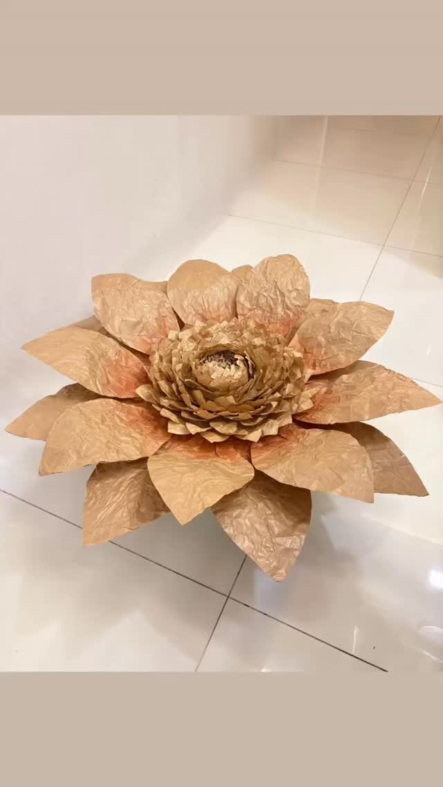 This is how we create beautiful larger than life flowers using simple Kraft paper, which is normally used for wrapping bouquets, parcels or even notebooks!✨✨#thepaperbloomsg #sustainableflowers #eventdecor #eventstyling #ecofriendlyflowers