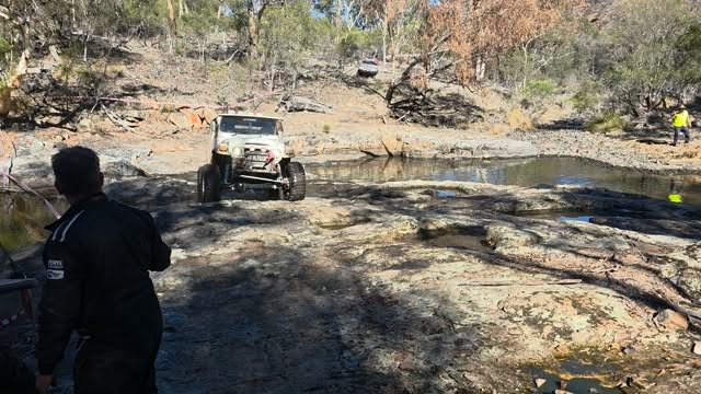 MDMA Mud Dog Motorsport Australia getting the climb out of the natural weir slightly wrong.