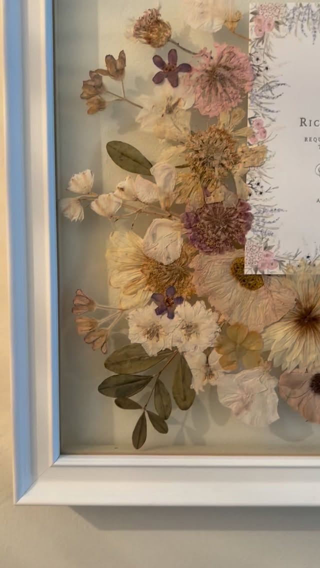 Two years married 🤍
Yesterday was my 2nd wedding anniversary, so I couldn’t resist looking back at our wedding stationery again.
I absolutely loved designing it and it turned out even better than I could have imagined… traditional & elegant but with a touch of magic ✨
One of the best decisions I made afterwards was having the main invitation framed alongside flowers from my bouquet by the incredibly talented @wildsweetpea . 🤍
It’s such a special keepsake and something I’ll treasure forever, which I get to look at it everyday 💐
#WeddingStationery #WeddingAnniversary #WeddingMemories #BespokeWeddingStationery WeddingKeepsake